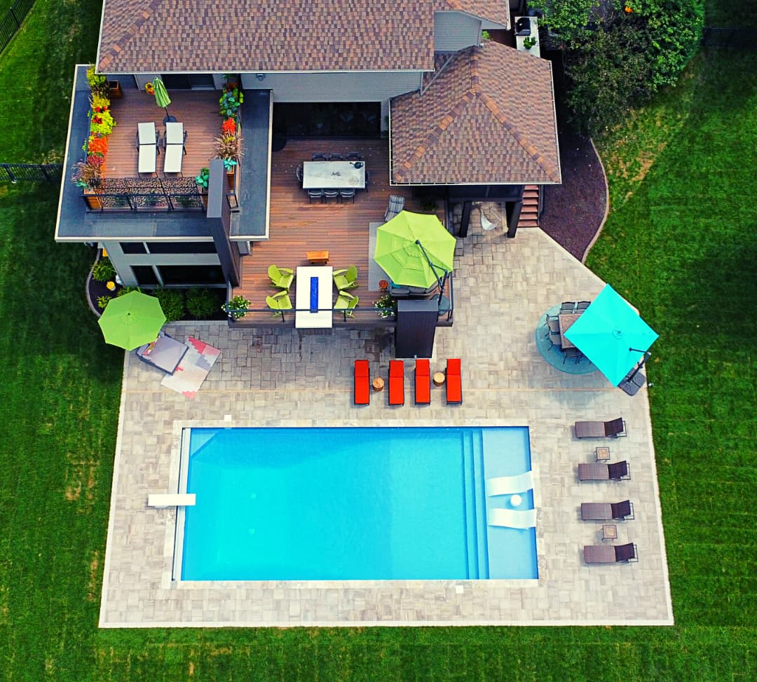 aerial view of an in-ground pool in a backyard