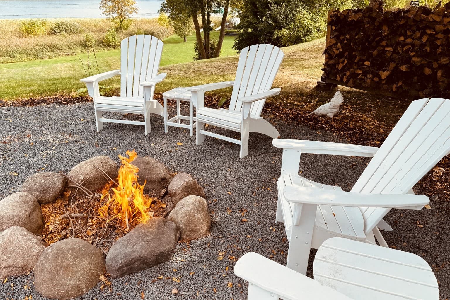 lawn chairs surrounding a classic fire pit.