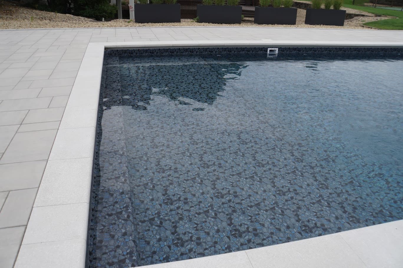 a close-up of a dark pool liner