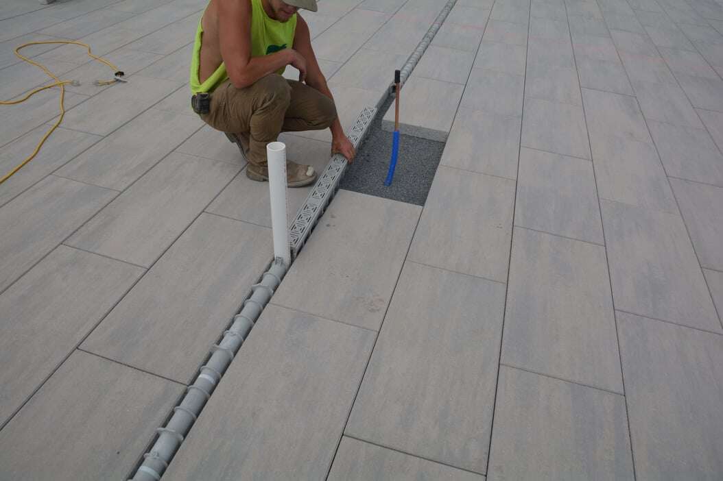 constructor laying hardscape tile