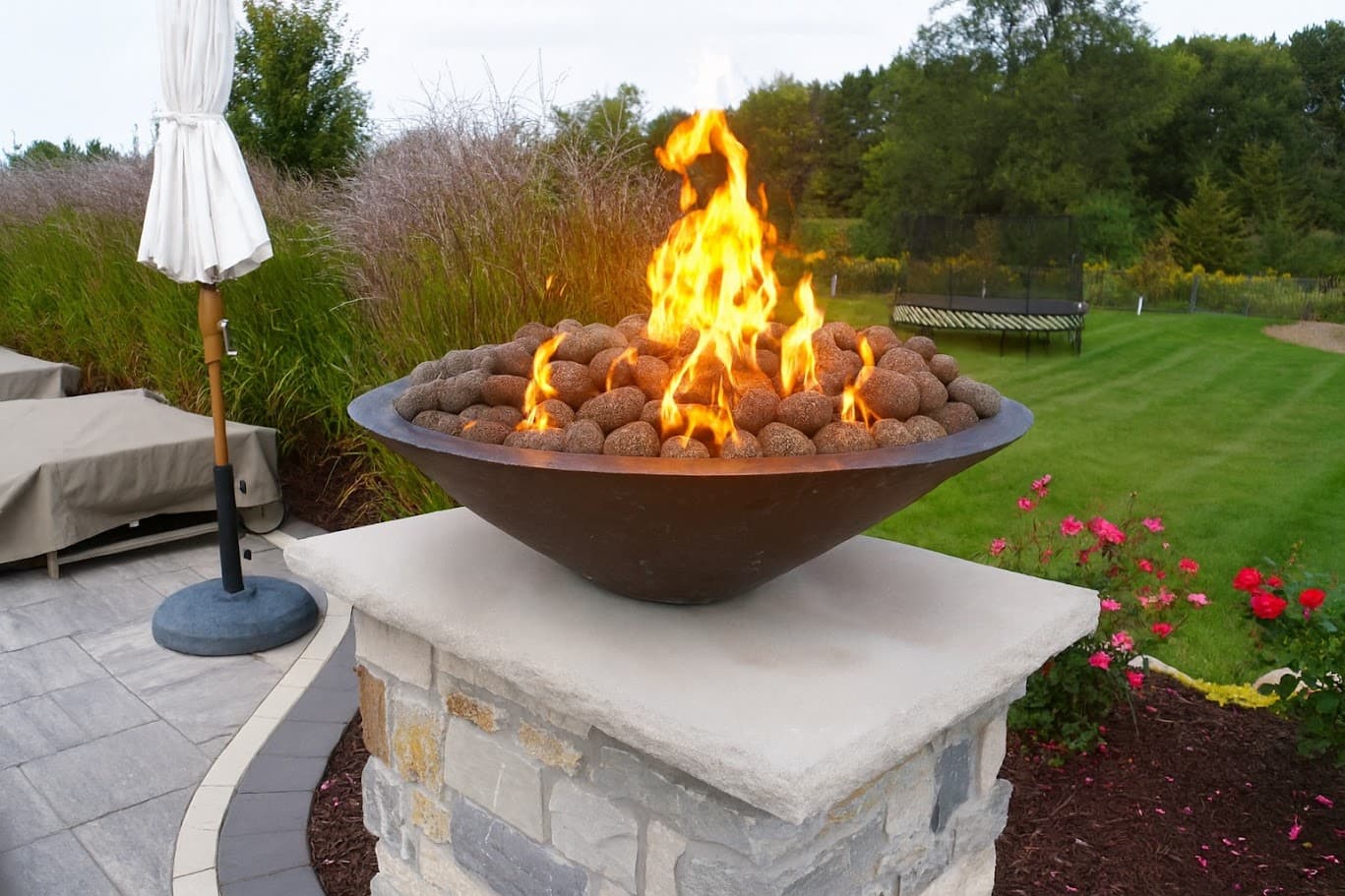 a fire bowl ontop of a pedestal