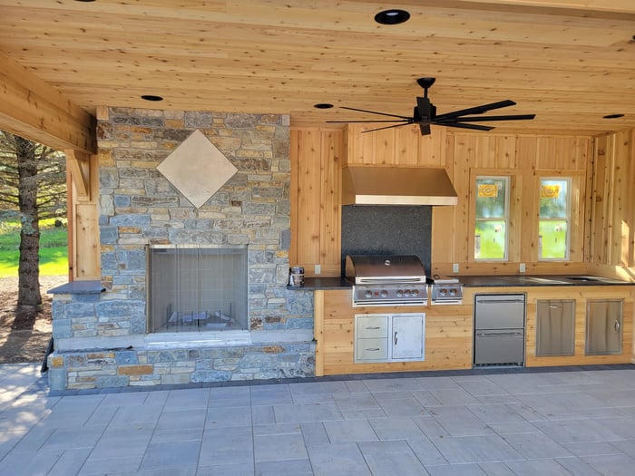 a grill station in an outdoor kitchen