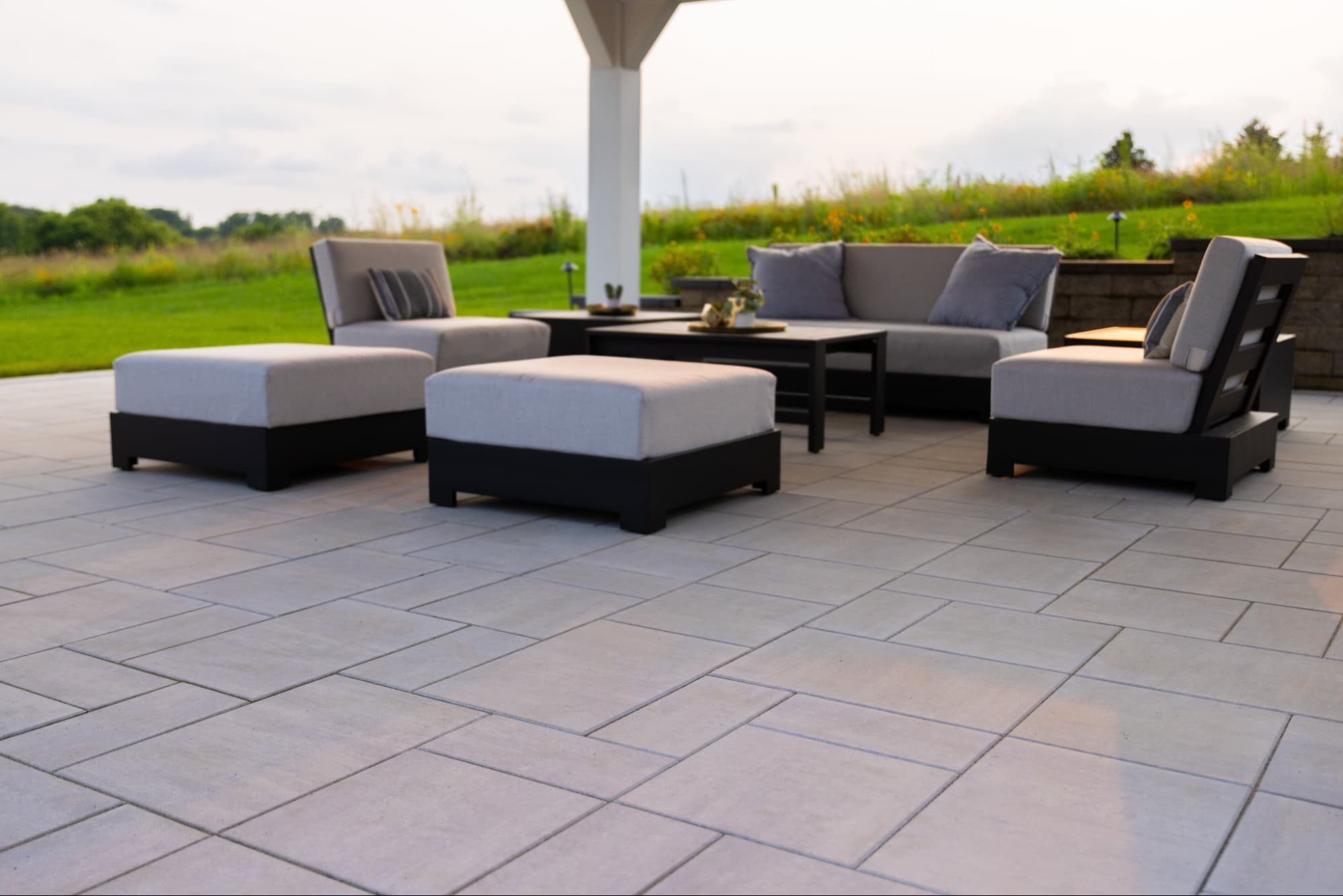 close up of hardscaped pavers surrounding an outdoor seating area