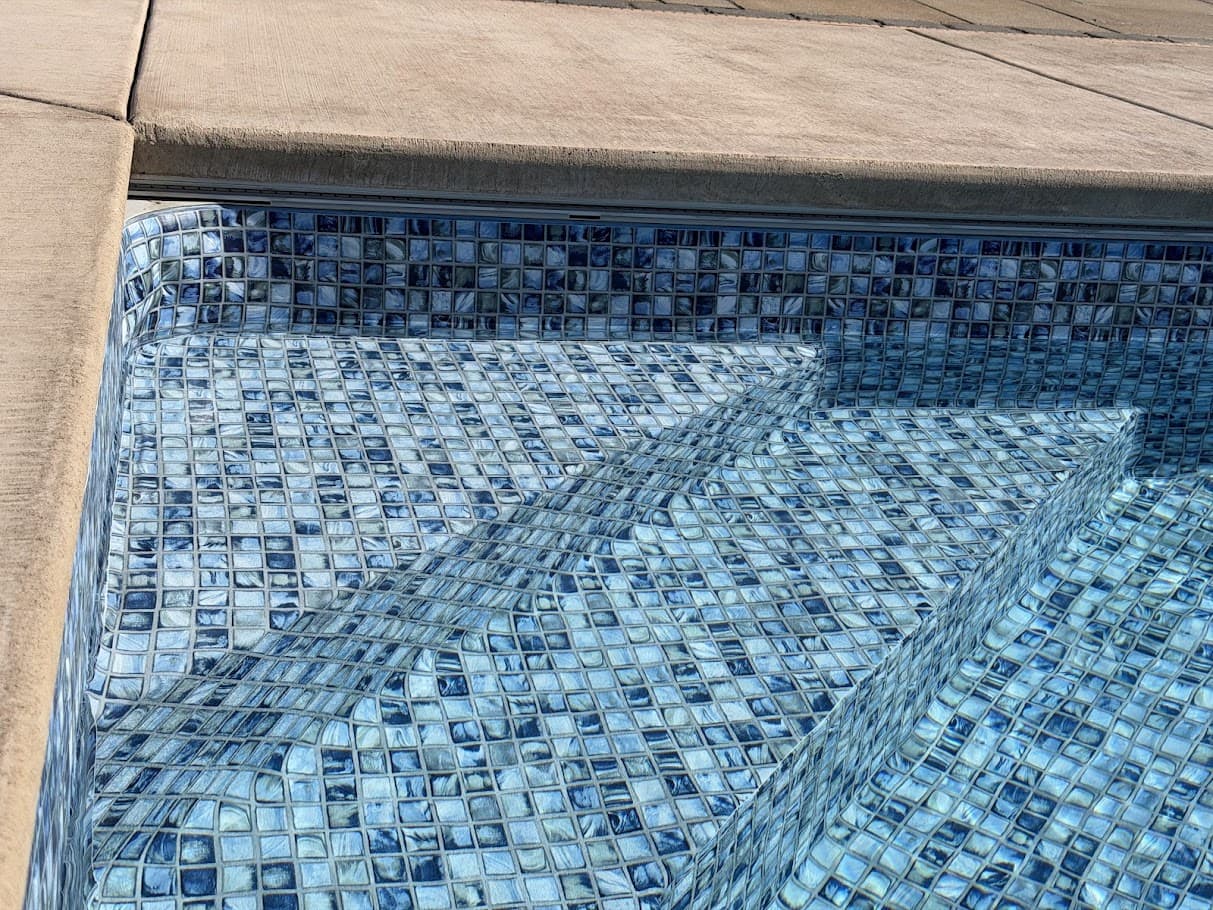 a close-up of stairs in a pool
