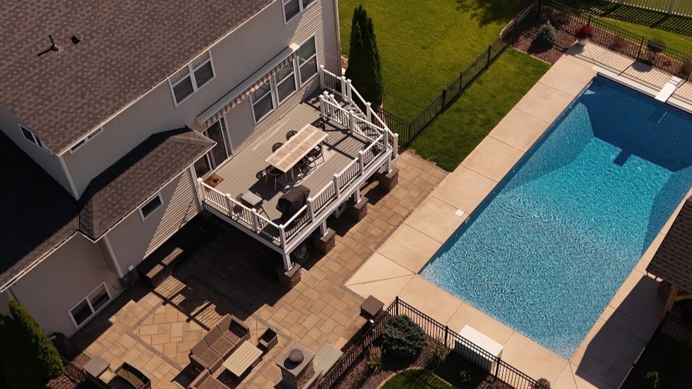 aerial view of a deck next to a pool