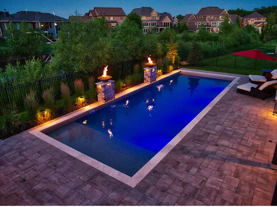 A pool surrounded by fire features