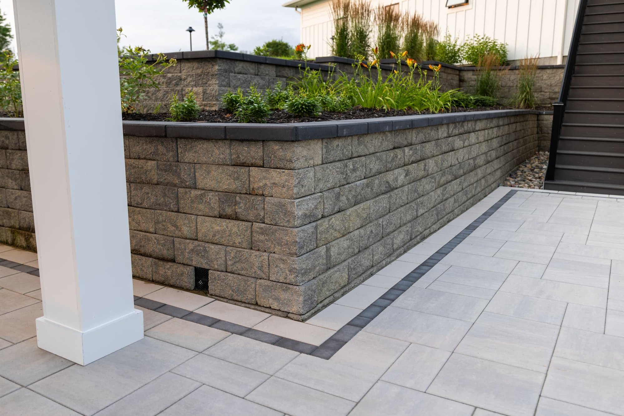 a retaining wall with garden bed