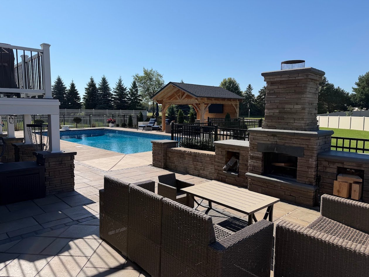 a patio with an outdoor fireplace