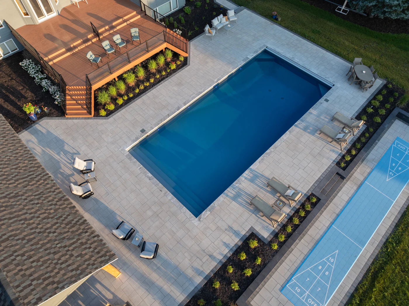 aerial view of pool surrounded by hardscaping