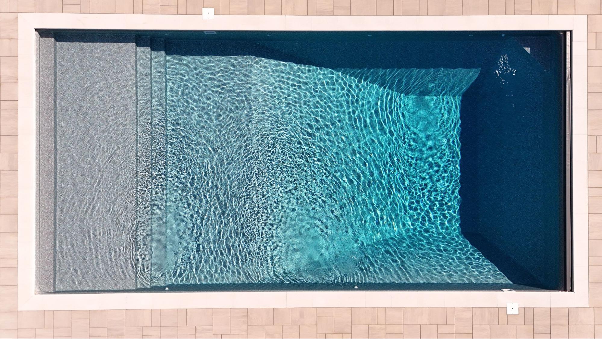 aerial view of an in-ground pool