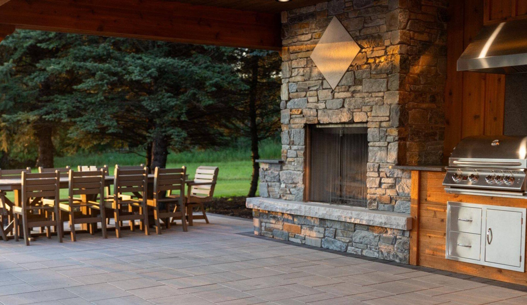 an outdoor kitchen with large brick oven